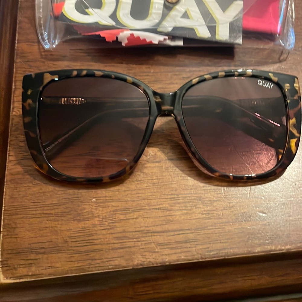 Tortoise shell Quay sunglasses worn once. Comes with case and cleaning cloth.